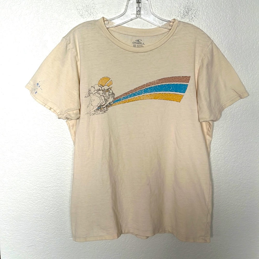 O’NEILL TSHIRT SIZE XS CREAM COLOR LIGHT BLUE PAINT ON R SLEEVE LOOKS GOOD TO ME